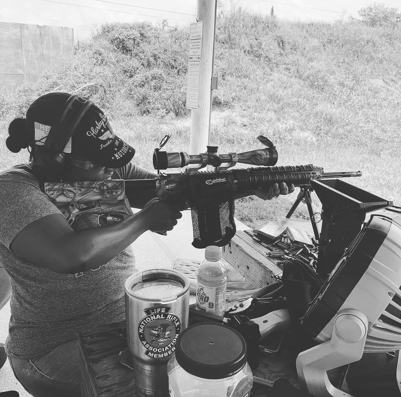 female shooter rifle bw