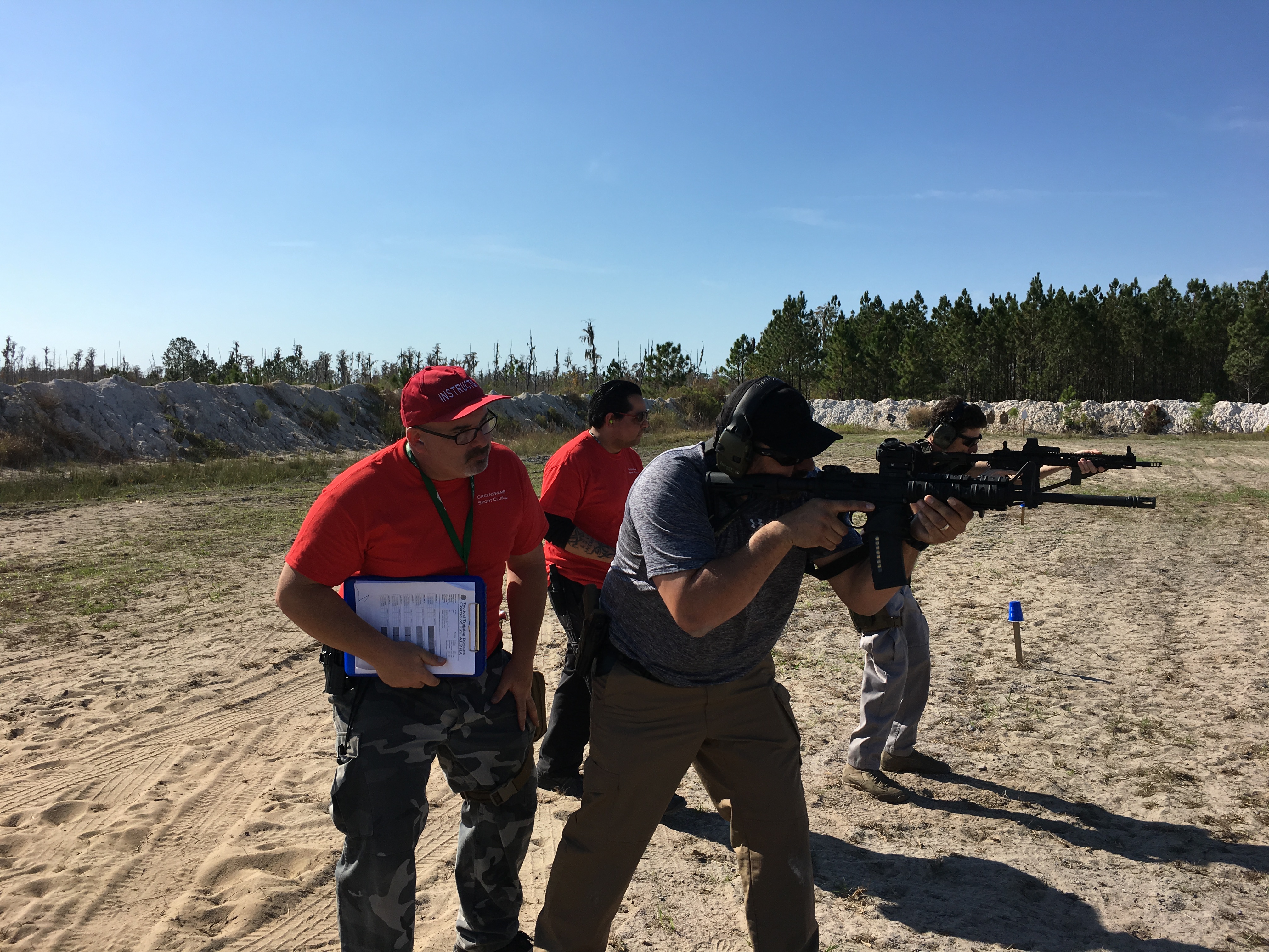 USS Academy instructors supervising students at range
